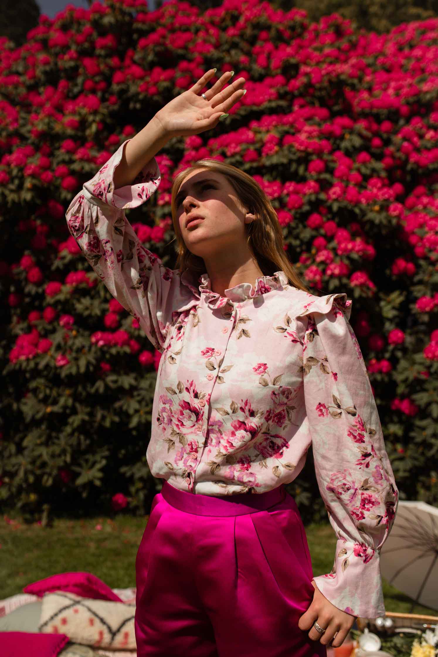 pink floral blouse and pink satin trousers. ladies office fashion